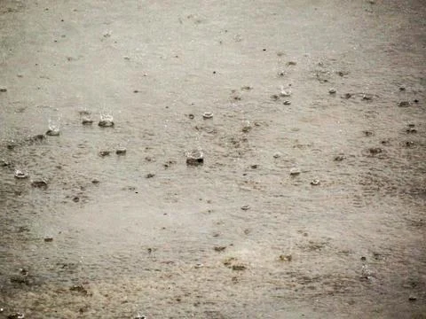 Drops of rain against the concrete Stock Photos