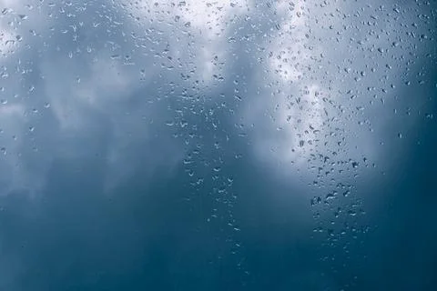 Drops of rain against storm clouds Stock Photos