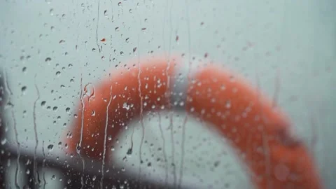 Drops Of Rain On A boat Window Pane, life ring In Background Stock Footage 162647734