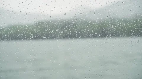 Drops Of Rain On A boat Window Pane, lake In Background Stock Footage 162647943