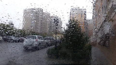 Drops of rain on car window pane Stock Footage 97141752