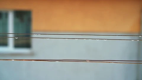 Drops of rain on the clothes line Stock Footage 128650691