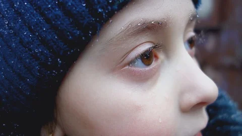 Drops from the rain on the eyelashes and eyebrows of a little girl. Stock Footage 104661525