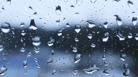 Drops of rain fall on the glass Stock Footage 88136860