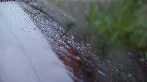 Drops of rain fall on the rear window of the car. Stock Footage 77174701