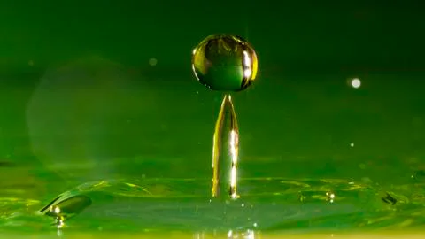 Drops of rain fall into the water, selective focus close-up 스톡 사진