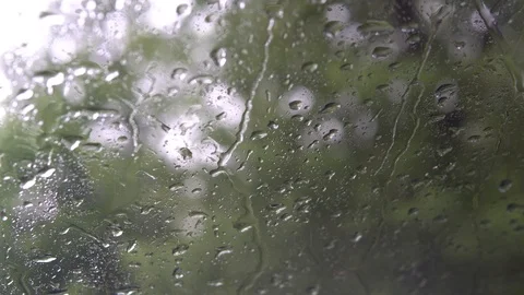 Drops of rain flow down the glass. It's raining Stock Footage 90504455