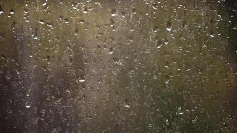 Drops of Rain Flow Down the Glass Against the Backdrop of Moving Cars Stock Footage 256163159