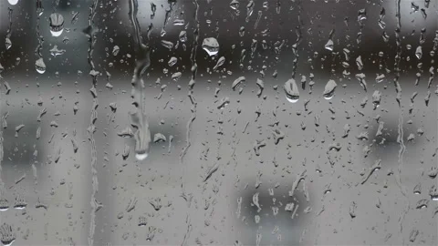 Drops of rain on glass , rain drops on clear window Stock Footage 103385189