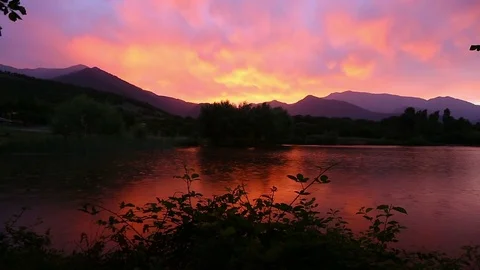 Drops of rain on the lake surface during sunset Stock-Footage 75980575