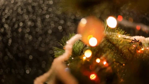 Drops of rain on New Year window glass on the background of the Christmas toys. Stock Footage 70739335