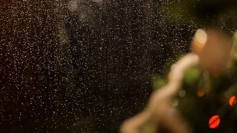 Drops of rain on New Year window glass on the background of the Christmas toys. Stock Footage 70739417