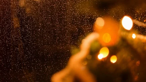 Drops of rain on New Year window glass on the background of the Christmas toys. Stock Footage 70768939