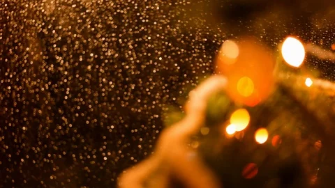 Drops of rain on New Year window glass on the background of the Christmas toys. Stock Footage 70769482