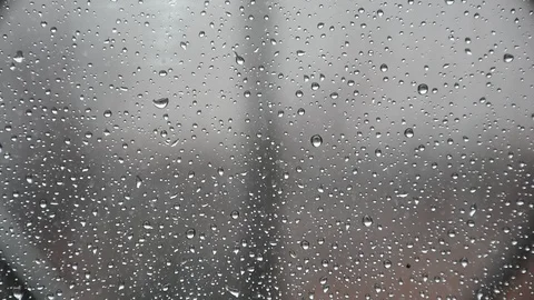 Drops of rain over the window in spring Stock Footage 89691248