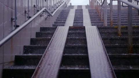 Drops of rain pour on the pavement and steps. HD, 1920x1080. Slow motion Stock Footage 78190586