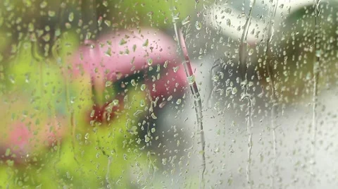 Drops of rain running down a windowpane Stock Footage 49678929