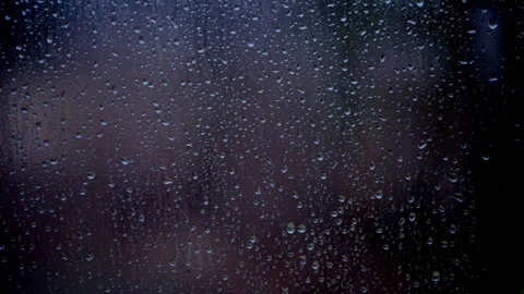 Drops of rain sliding down slowly on window glass, rainstorm, rainy season, Stock Footage 311298828