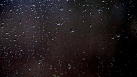 Drops of the rain sliding down slowly on the window glass, rainstorm, rainy Stock-Footage 311497542