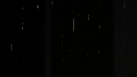 Drops of rain water dripping down in the night on dark background. Stock Footage 202178528