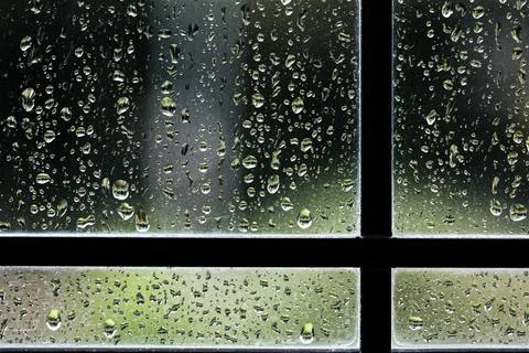 Drops of rain on wet window pane close up 스톡 사진
