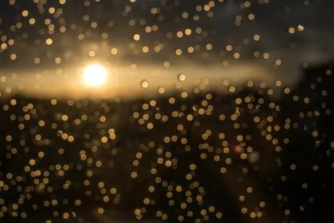 Drops of rain on window after a storm. Water drops on the glass after rain. Stock Photos