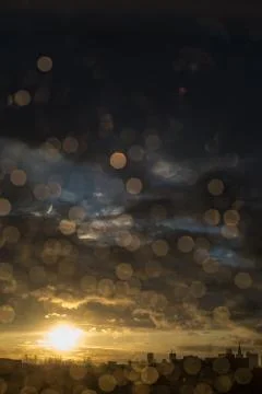 Drops of rain on window after a storm. Water drops on the glass after rain. Stock Photos
