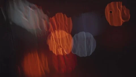 Drops of rain on the window and glare of light on the background 스톡 동영상 76612533