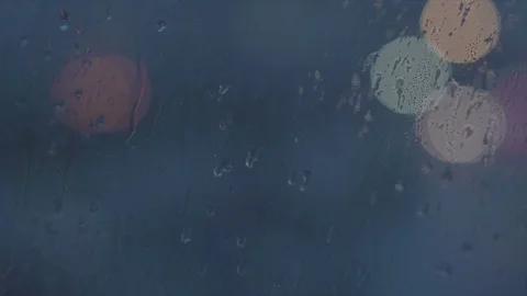 Drops of rain on the window and glare of light on the background 库存影片 76619693