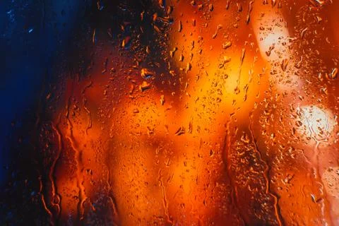 Drops of rain on the window of the car in the evening Stock Photos
