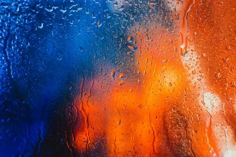Drops of rain on the window of the car in the evening Stock Photos