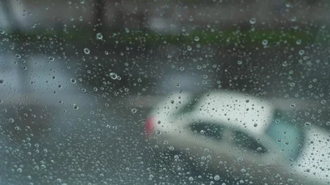 Drops of rain on a window glass Video stock 329093483