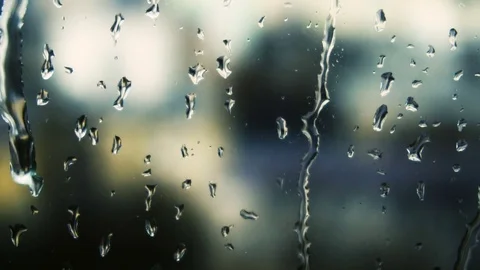 Drops of rain on a window pane, buildings in background Stock Footage 83391650