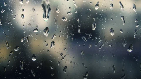 Drops of rain on a window pane, buildings in background Stock Footage 83721464