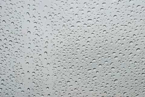 Drops of rain on a window Stock Photos