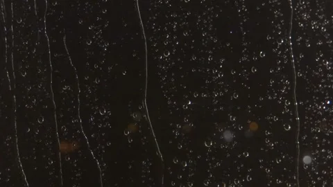 Drops of rain on the windows and thunderstorm in the night_1 Stock Footage 157654224