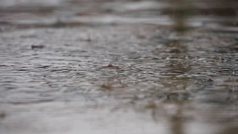 Drops of rainwater falling on the ground on a rainy day 스톡 동영상 90359330