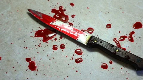Drops of red blood falling on the dirty knife. Concept of domestic criminal Stock Footage 114893460