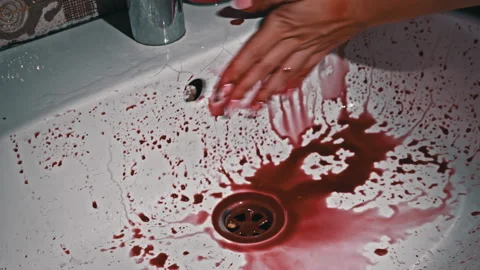 Drops of Red Blood from Hands Drip into a White Washbasin Close-up Stock Footage 213606821