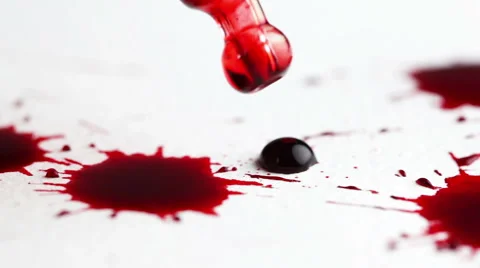 Drops of red liquid on white background, pipette is taking a sample Stockbeeldmateriaal 42985244