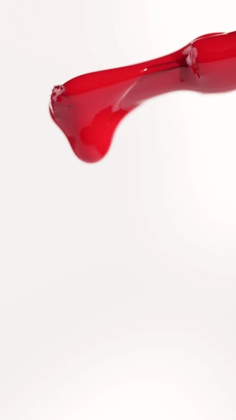 Drops of red nail polish falling from a brush, macro. Varnish nail polish Stock Footage 311800746