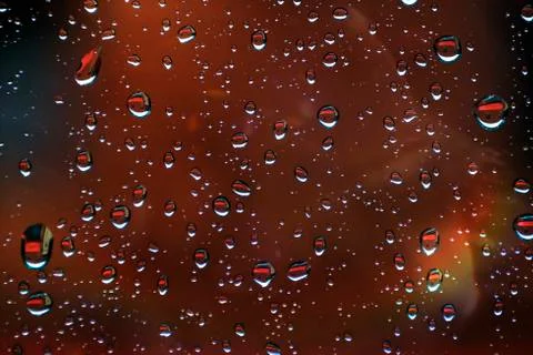 Drops reflected in the window with colorful reflections 스톡 사진