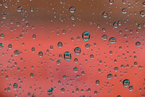 Drops reflected in the window with colorful reflections 스톡 사진