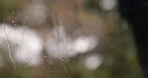 Drops sliding on window glass. Rain drops on glass Stock Footage 190940658