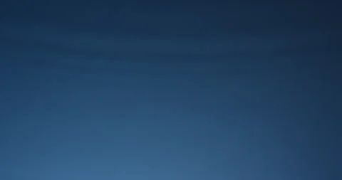 Drops splashing in slow motion and making ripples on a water surface. Underwater Stock Footage 151644740