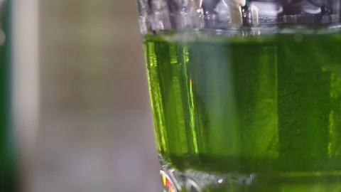 Drops of sugar drip into absinthe Stock Footage 129008253