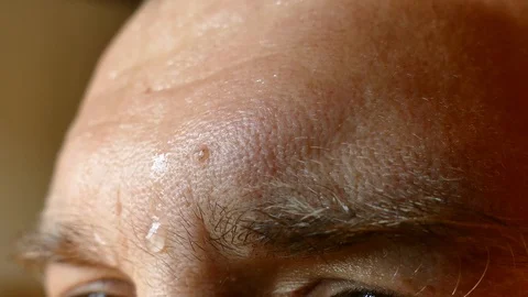 Drops of sweat flow down the forehead of a person. Sweaty Stock Footage 110905618