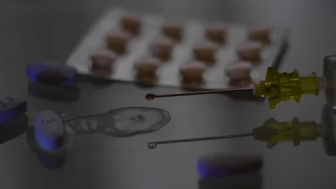 Drops from a syringe Stock Footage 86127385