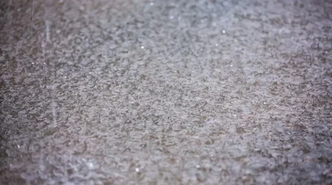 Drops Of Torrential Rain Falling On The Ground And Splashing Video stock 53495376