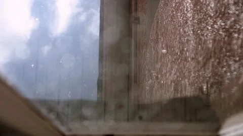 Drops of water after the rain fall from top to bottom from the roof of the house Stock Footage 340329291